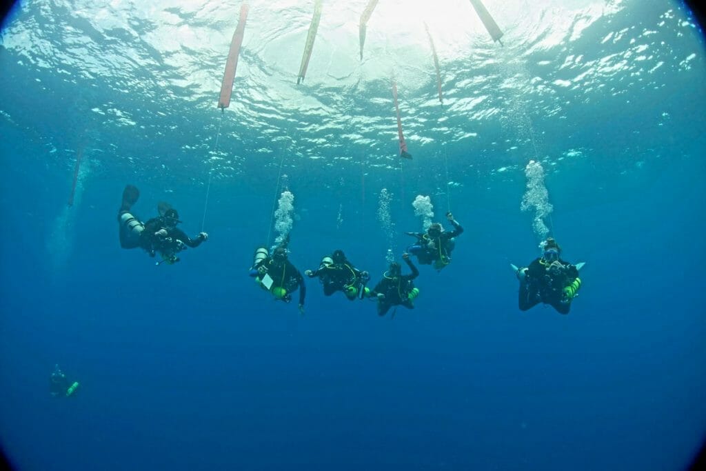Group of technical divers doing a decompression stop