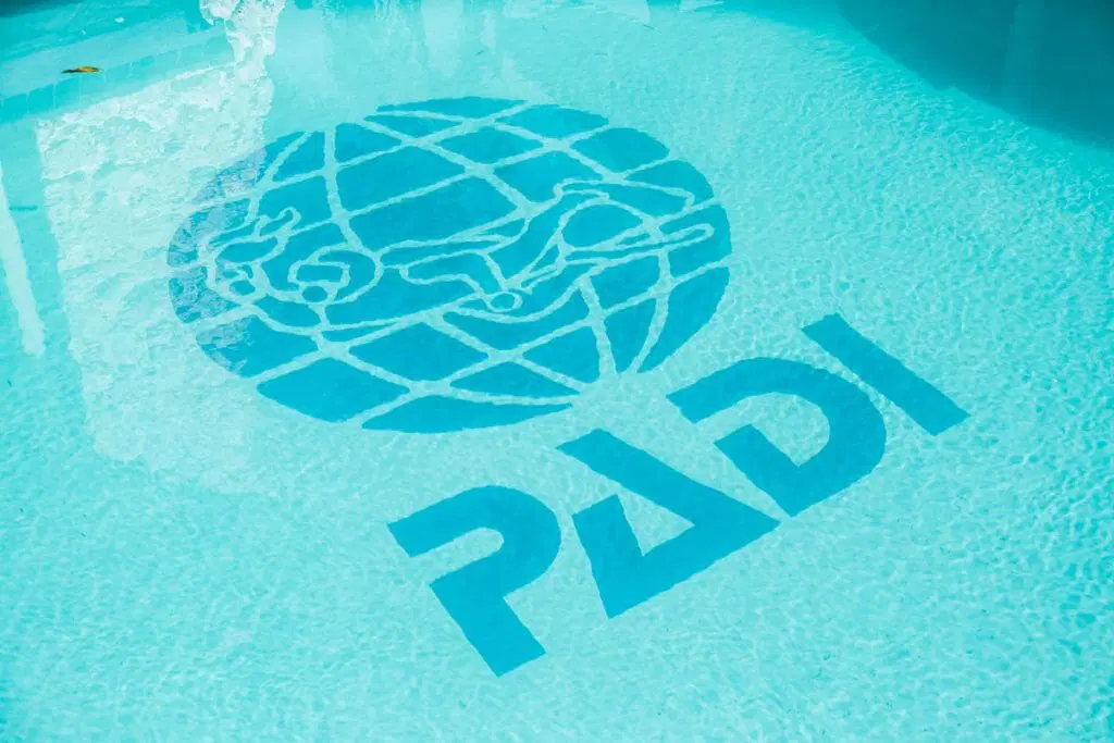 PADI logo on the bottom of a pool