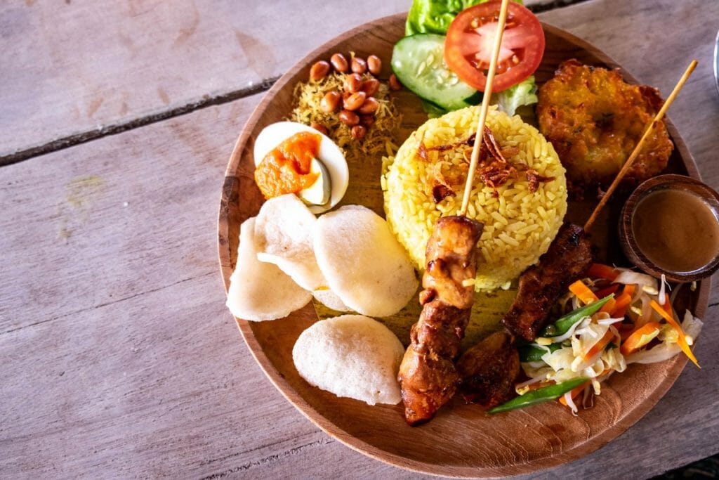 Wooden plate with Nasi Campur