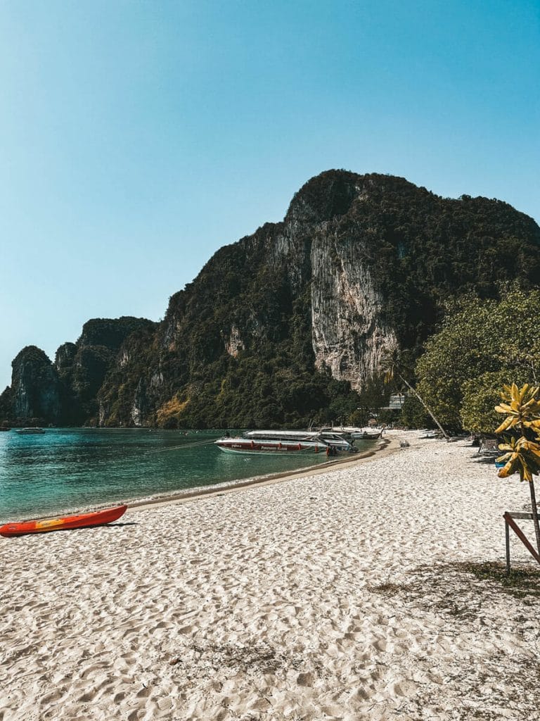 beach and karsts at koh Phi Phi with red kayak