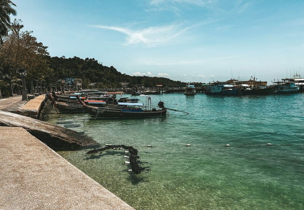 scuba gear floating in the water by the pier in koh phi phi