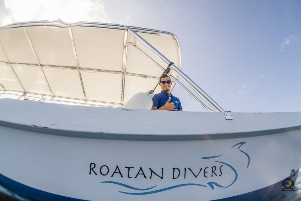 Side of the boat with Roatan Divers logo