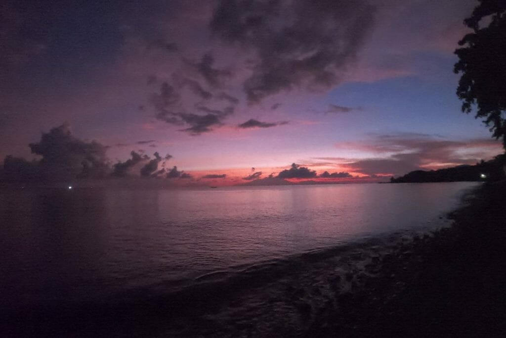 pink sunrise over the ocean at tulamben beach