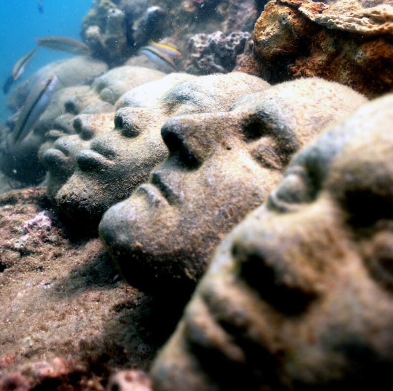 Close-up of faces at Underwater Sculpture Park in Grenada