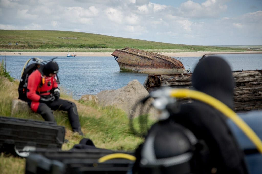 Divers in Scapa Flow on shore