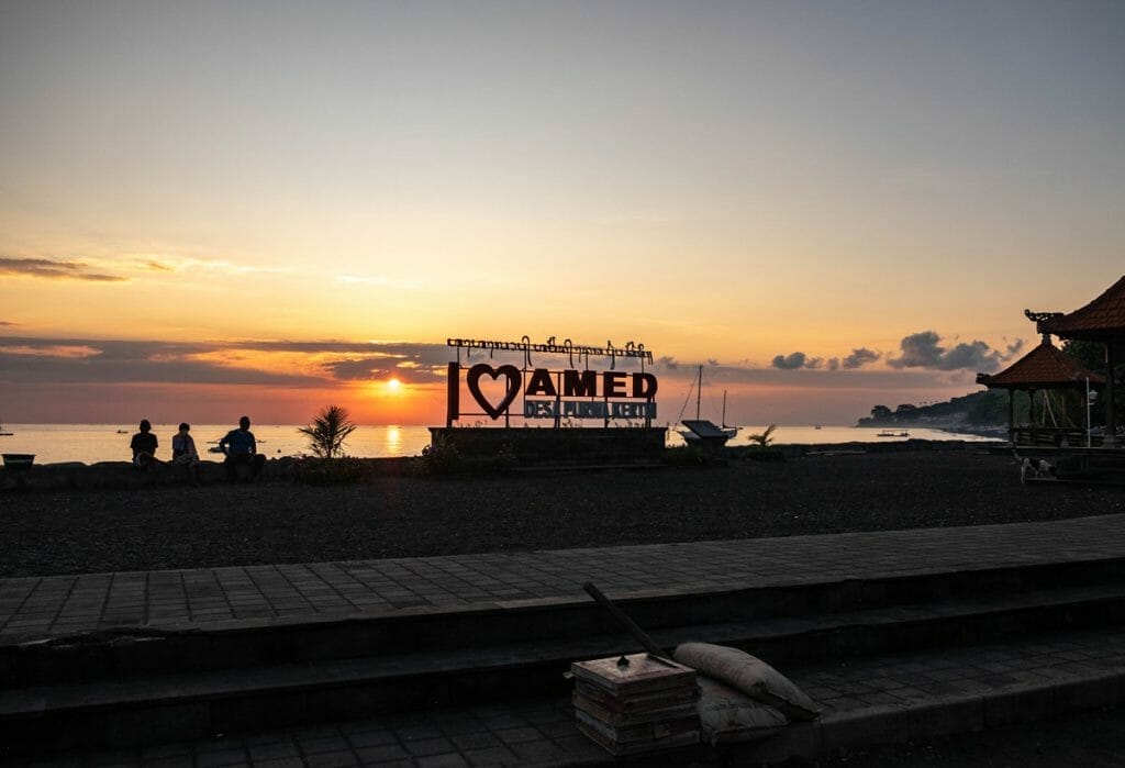 I love Amed sign on Amed beach at sunrise