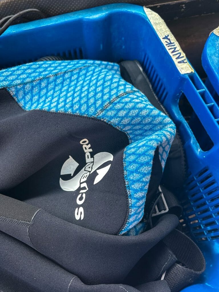 Scubapro wetsuit in a blue crate